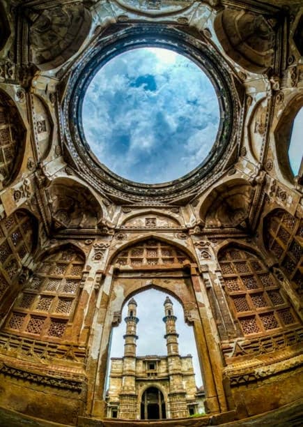 Looking up through the carved dome of the Jama Masjid at Champaner to the minarets beyond